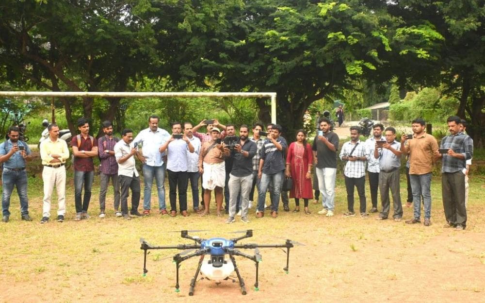 People watching an outdoor drone demonstration